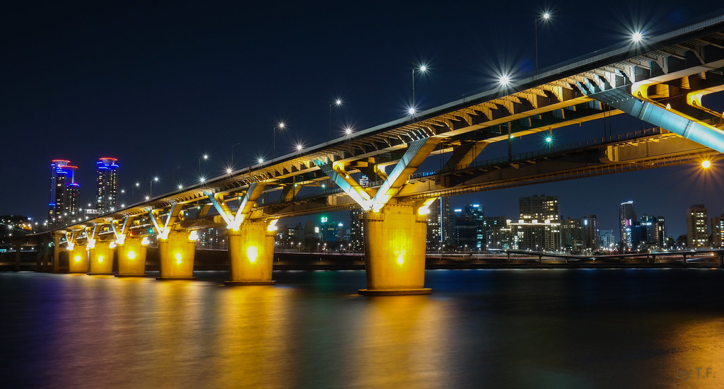 Cheongdam Bridge at night, the Han River below and the Seoul skyline behind it